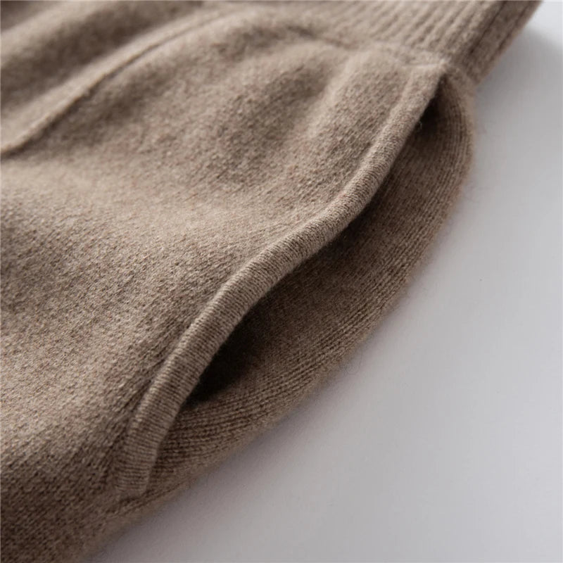 Hidden side pocket detail of pastel brown cashmere trousers with tuck detail — From Borcelleclothes.