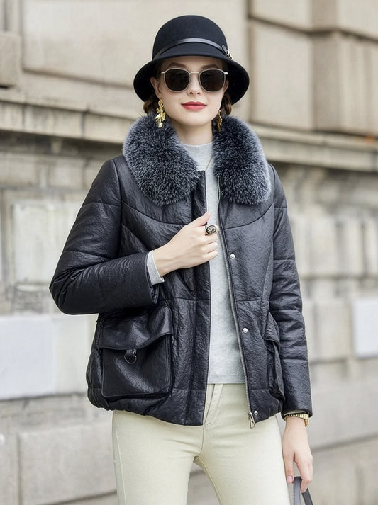 Women's compressed surface sheepskin coat with fox fur collar, curved quilted seams, and drawstring waist — shown in Abyss color — From Borcelleclothes.