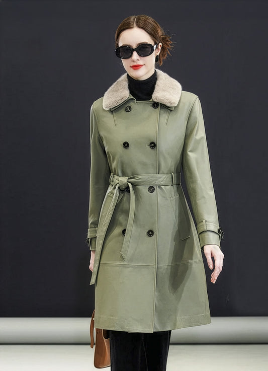 Model in Frost Mint sheepskin coat walking, coat in motion with detachable mink collar and tied belt — From Borcelleclothes.
