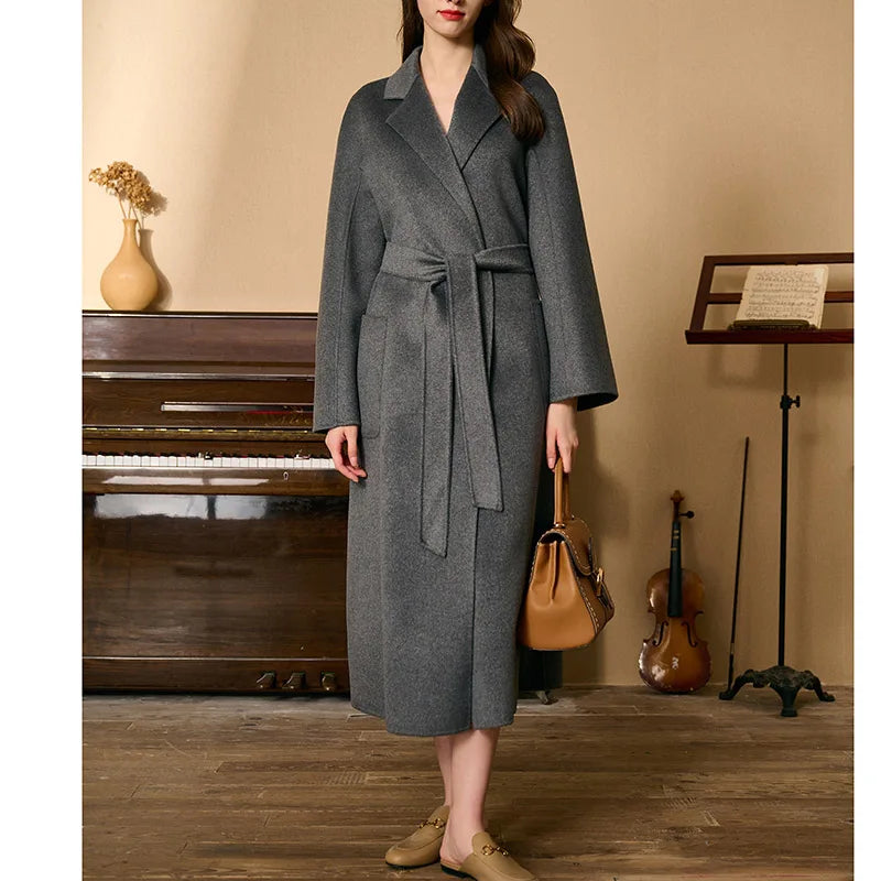 Women's Double-sided cashmere wrap coat in Carbon Grey with notched lapels and patch pockets, secured with a matching belt. From Borcelleclothes.