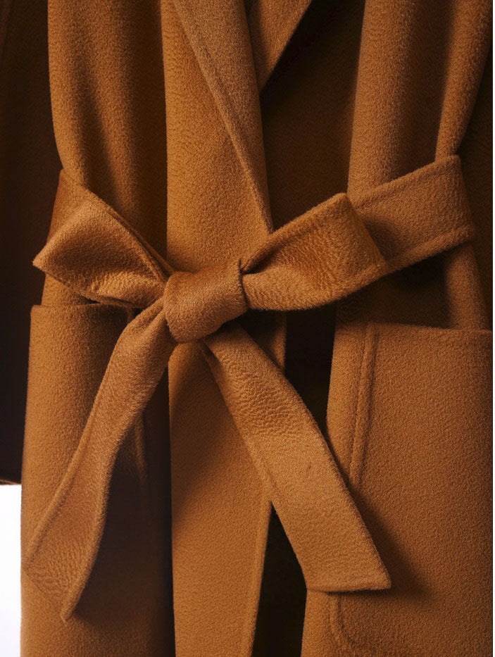 Tied belt in a bow of a Women's Double-Sided Cashmere Wrap Coat in Sienna. From Borcelleclothes.