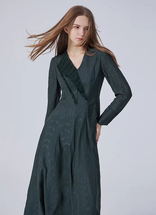 Model wearing the embroidered jacquard silk dress in Outer Space, hand resting on hip. From Borcelleclothes.