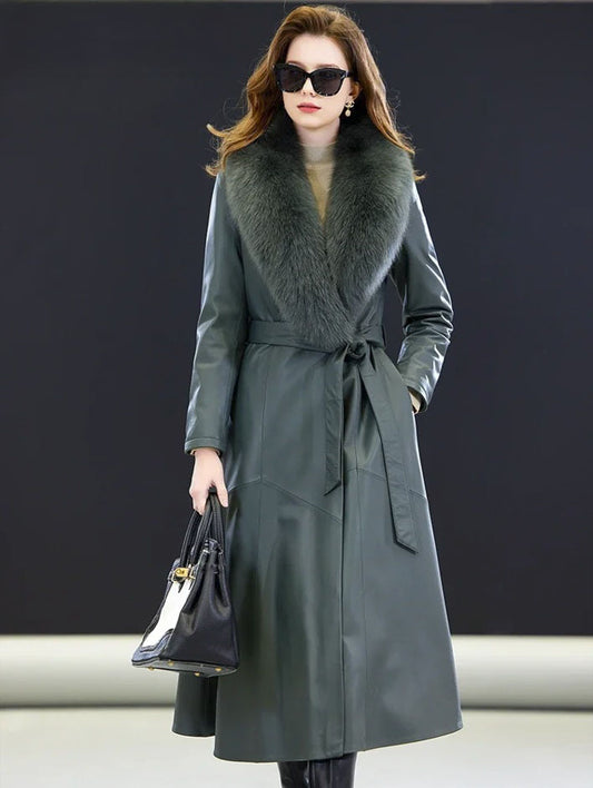 Women's Fiord Leather Coat. Model carries a structured handbag, accentuating the coat’s refined flared silhouette and deep oceanic hue. Borcelleclothes.