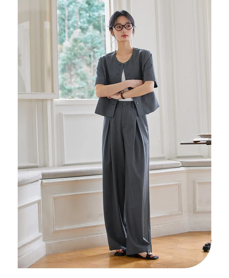 Model wearing the Fiord set with her arms crossed in front of her. From Borcelleclothes.