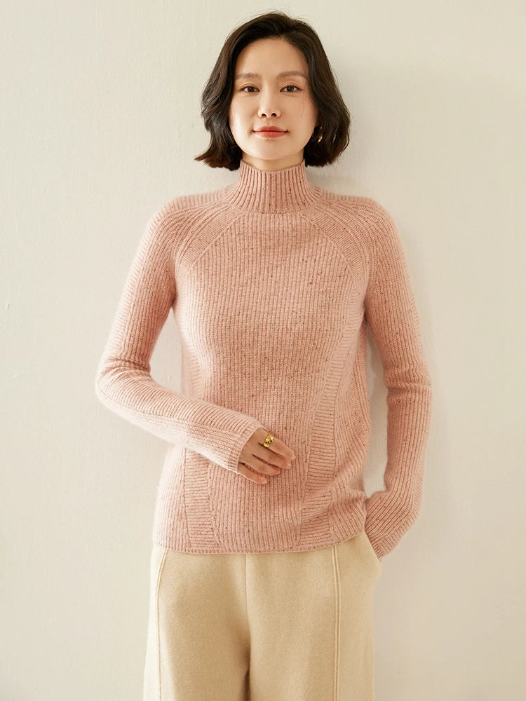 Women's Slim-fitting Fisherman rib cashmere sweater in Delicate Bloom color, with sculptural raglan lines, mock neck, and diagonal purl panels — From Borcelleclothes.