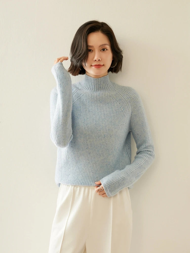 Winter’s Breath Fisherman rib sweater, model with raised arm revealing sleeve construction and subtle melange — From Borcelleclothes.