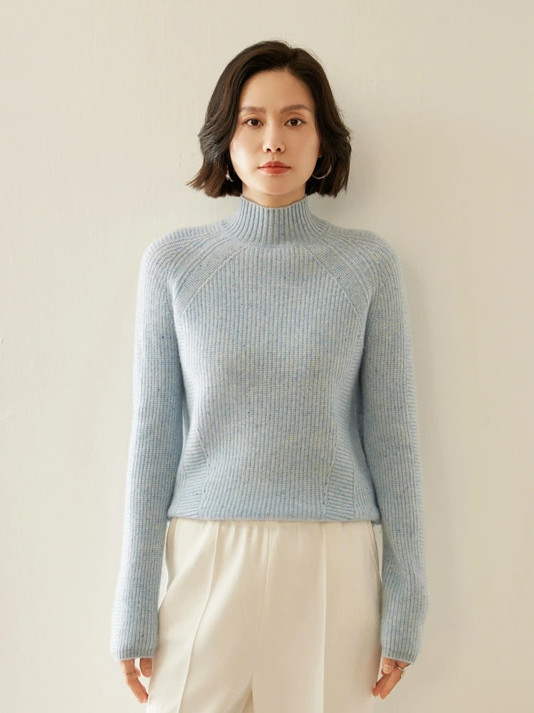 Women's Slim-fitting Fisherman rib cashmere sweater in Winter's Breath color, with sculptural raglan lines, mock neck, and diagonal purl panels — From Borcelleclothes.