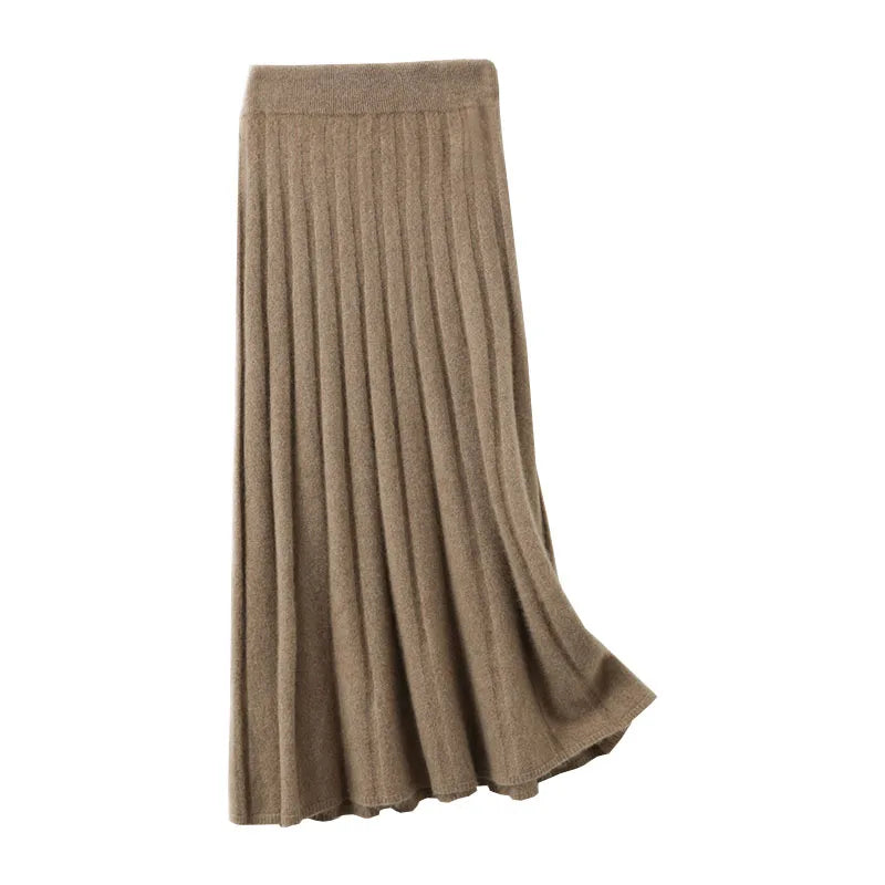 Women's flared pleat wool skirt in Pastel Brown showing soft draping — From Borcelleclothes.