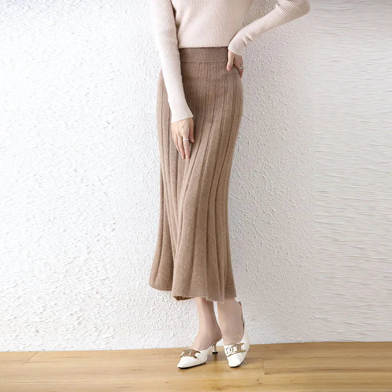 Women's flared pleat wool skirt in Pastel Brown, model with hand on hip — From Borcelleclothes.