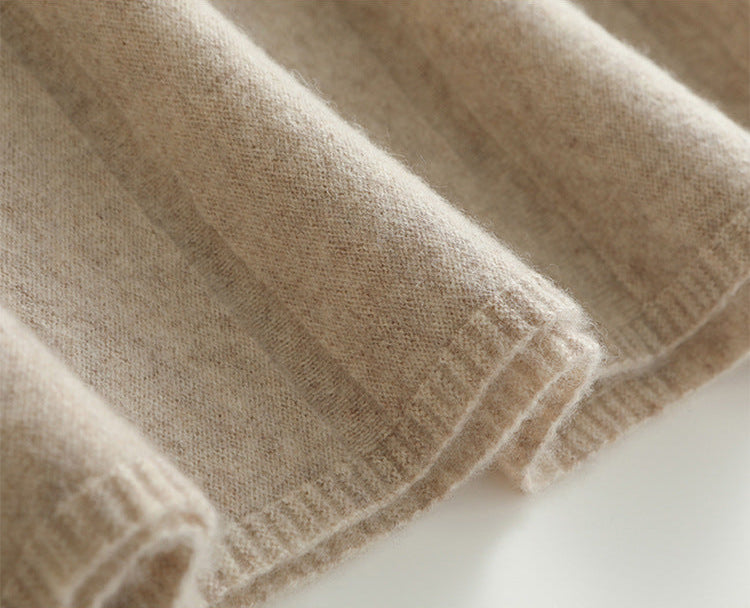 Close-up of a texture of a Women's Wool skirt In White Chocolate, with expanding pleats and soft volume near the hem — From Borcelleclothes.