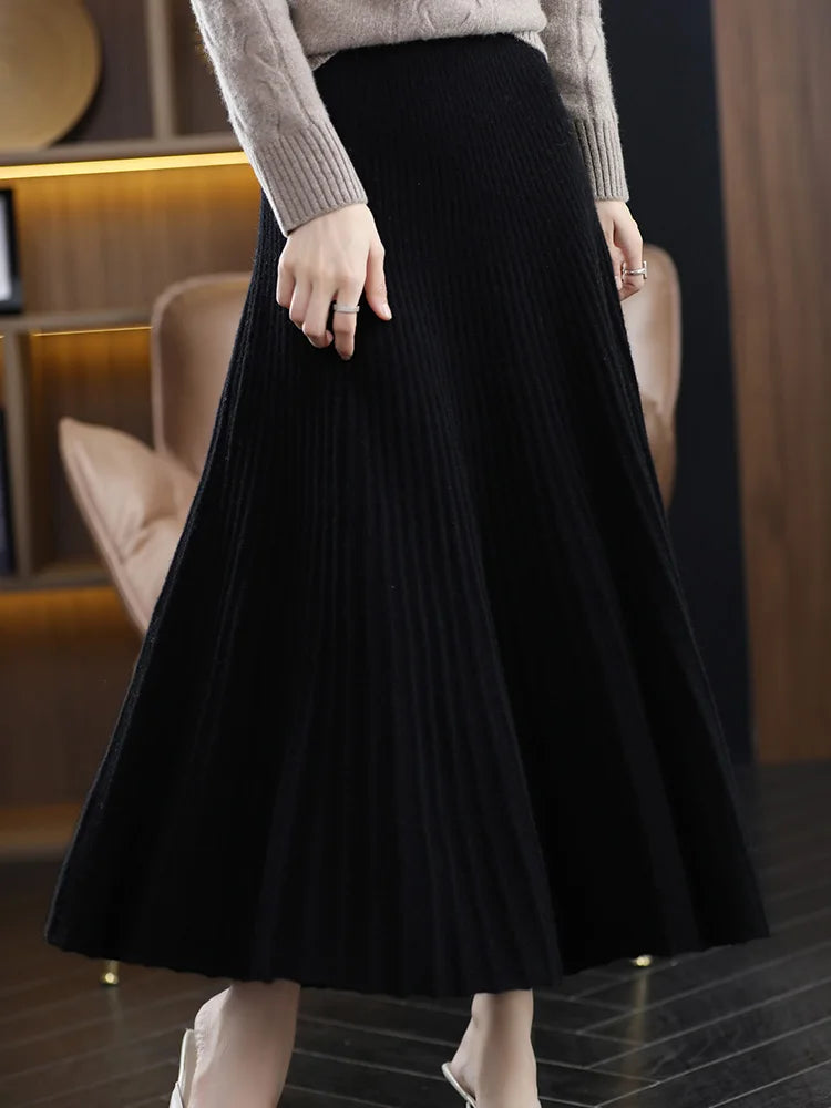 Model walking in the Onyx Merino skirt, flared hem shifting like soft waves with each step — From Borcelleclothes.