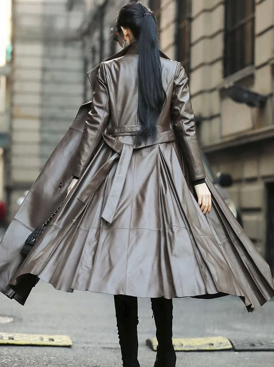 Women's Flowing Leather Coat in Taupe. Model twirls, capturing the coat’s mesmerizing leather movement and graceful proportions. Borcelleclothes.