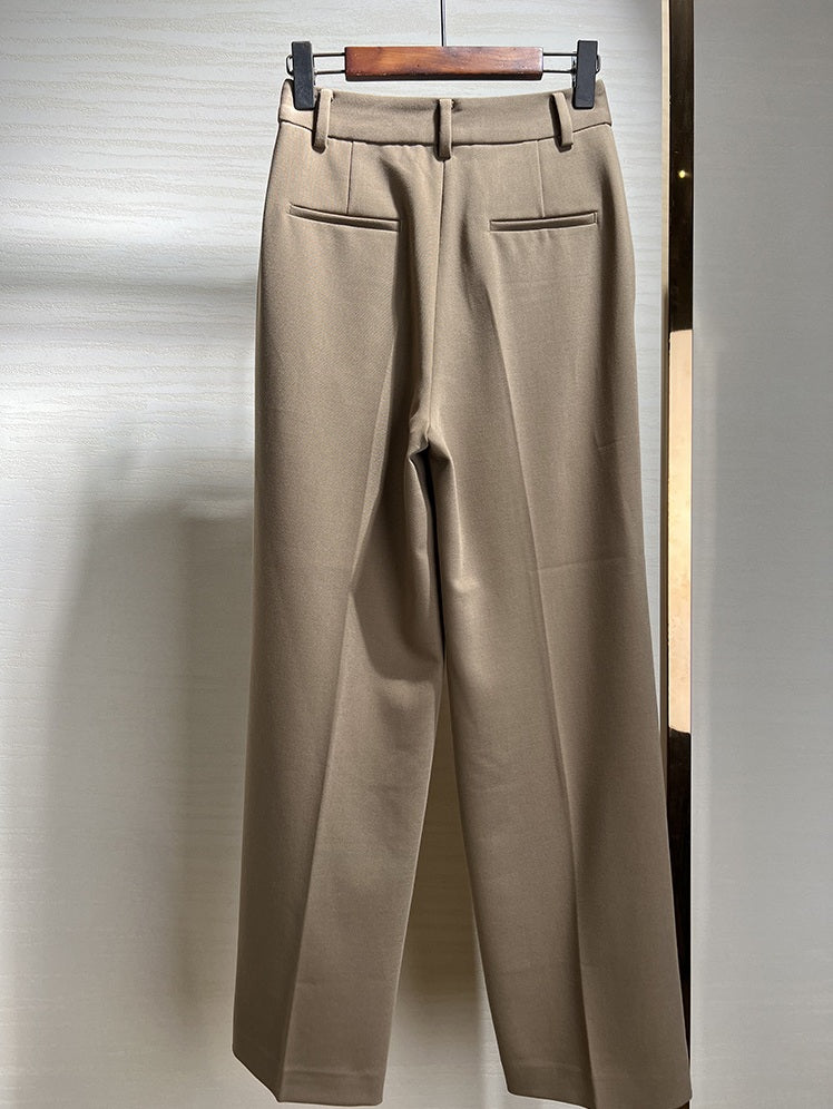 Back view of Almond Frost trousers on hanger, with visible darts and tailored cut. From Borcelleclothes.