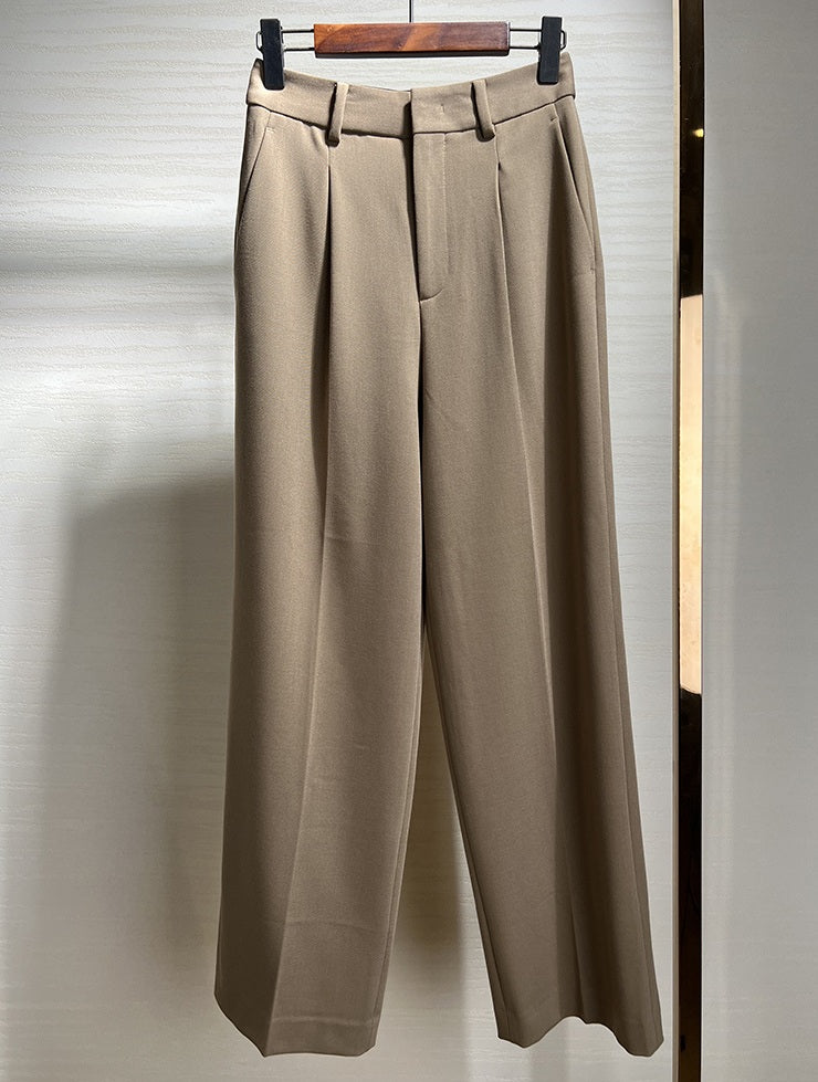 Almond Frost trousers hanging front-facing, showing crisp front creases and drape. From Borcelleclothes.