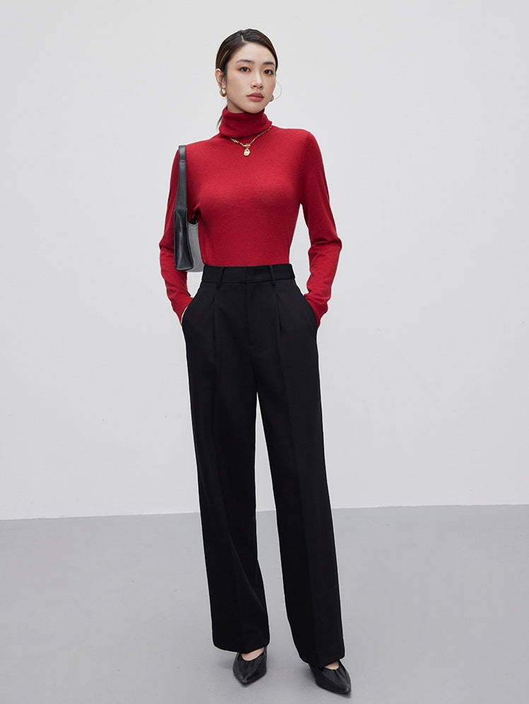 Woman with hands in pockets of Onyx trousers, showcasing relaxed posture and refined fit. From Borcelleclothes.
