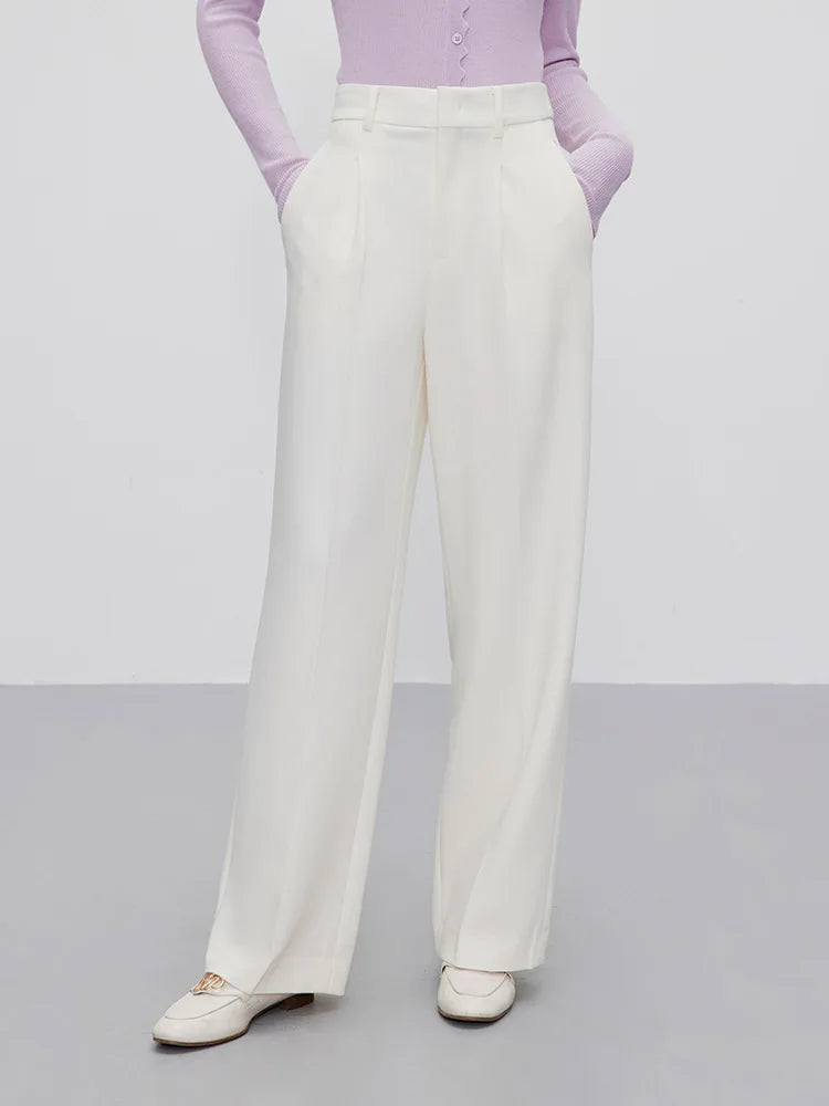 Women’s fluid wool-blend trousers in Platinum, featuring a soft tailored drape, front tucks, and a clean waistband with belt loops. From Borcelleclothes.