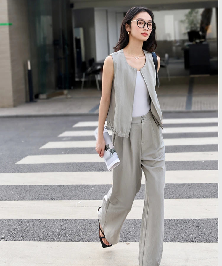 Model in motion crossing a pedestrian crosswalk in the French Grey outfit. From Borcelleclothes.