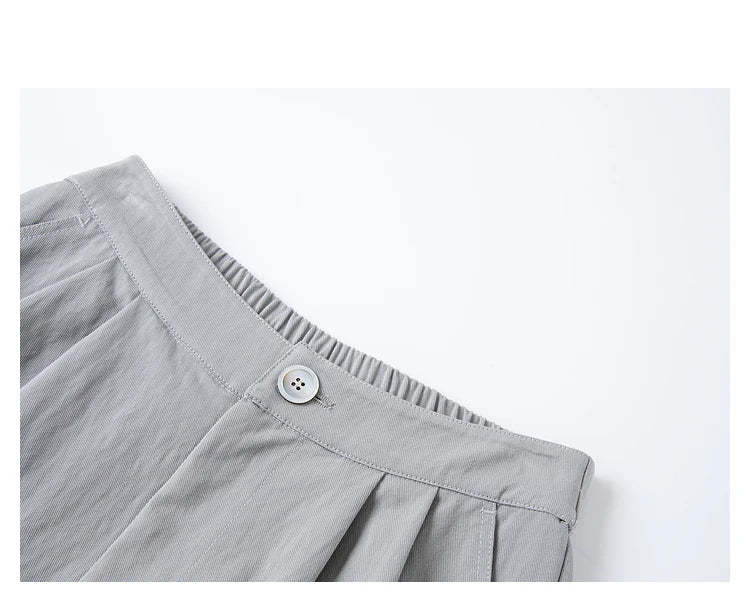 Close-up of the waistband and upper section of the trousers in French Grey. From Borcelleclothes.