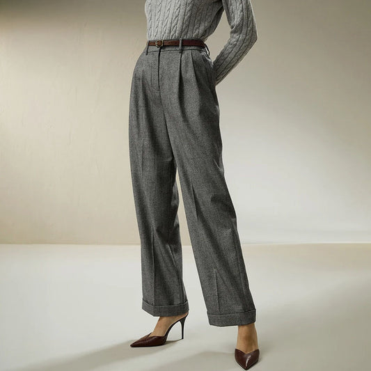 Women’s Glen Check flannel trousers in Concord — wide-leg, straight-cut design in brushed wool with front pleats, turned-back cuffs, and a muted Glen Check pattern that reveals heritage in structure, not spectacle. From Borcelleclothes.