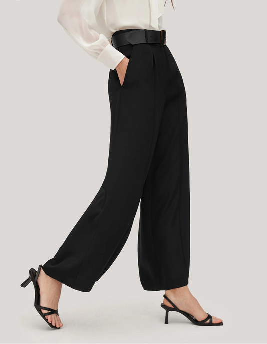 Side view of women's wide-leg silk trousers in Onyx, showing the fluid fall and defined structure of heavy crepe. From Borcelleclothes.