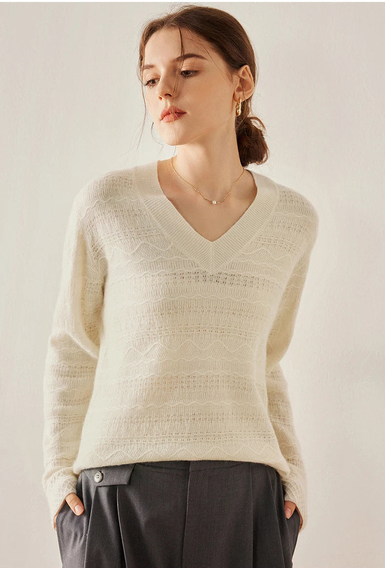 Himalayan cashmere sweater in Pearl Bush with model’s hands in both pants pockets — From Borcelleclothes.