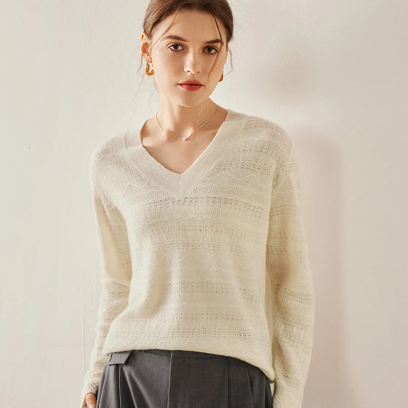 Himalayan cashmere sweater in Pearl Bush with model resting hand on hip — From Borcelleclothes.