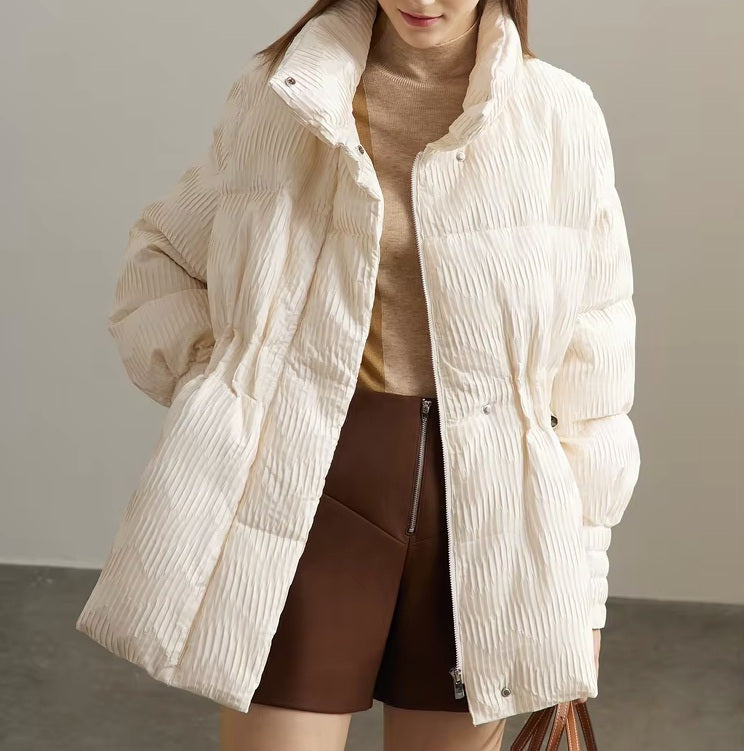 Women's jacquard down jacket in Pearl Bush with high wrap-style collar, pleated waist, and gloss-matte zigzag texture. From Borcelleclothes.