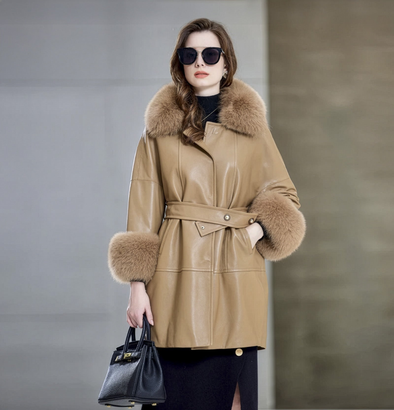 Women’s sheepskin coat in Light French Beige, with fox fur collar and kimono sleeves, belted waist, and thigh-length silhouette. — From Borcelleclothes.