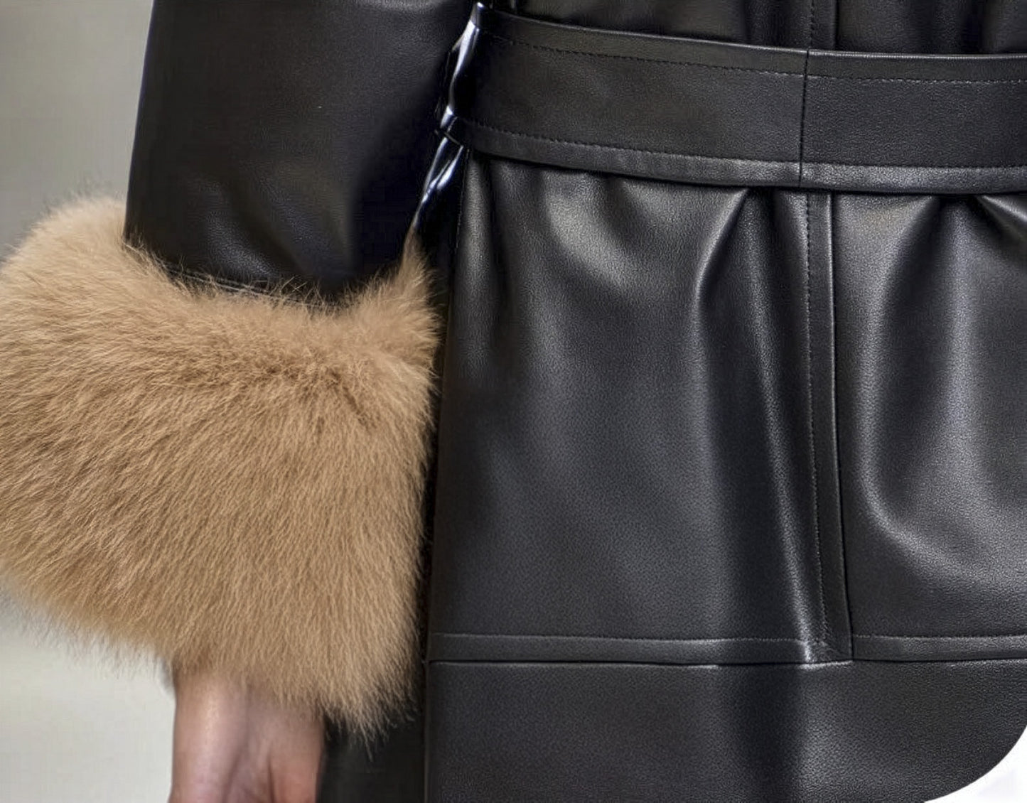 Cuff detail of the Onyx sheepskin coat, highlighting the smooth leather finish and open sleeve. — From Borcelleclothes.