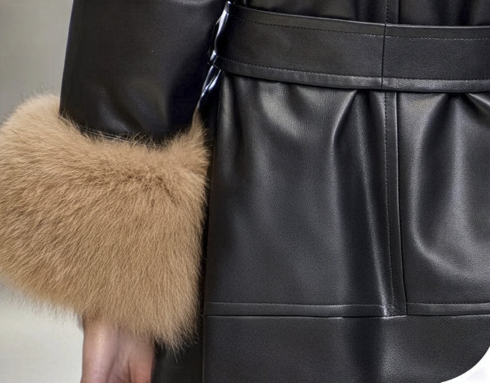 Cuff detail of the Onyx sheepskin coat, highlighting the smooth leather finish and open sleeve. — From Borcelleclothes.