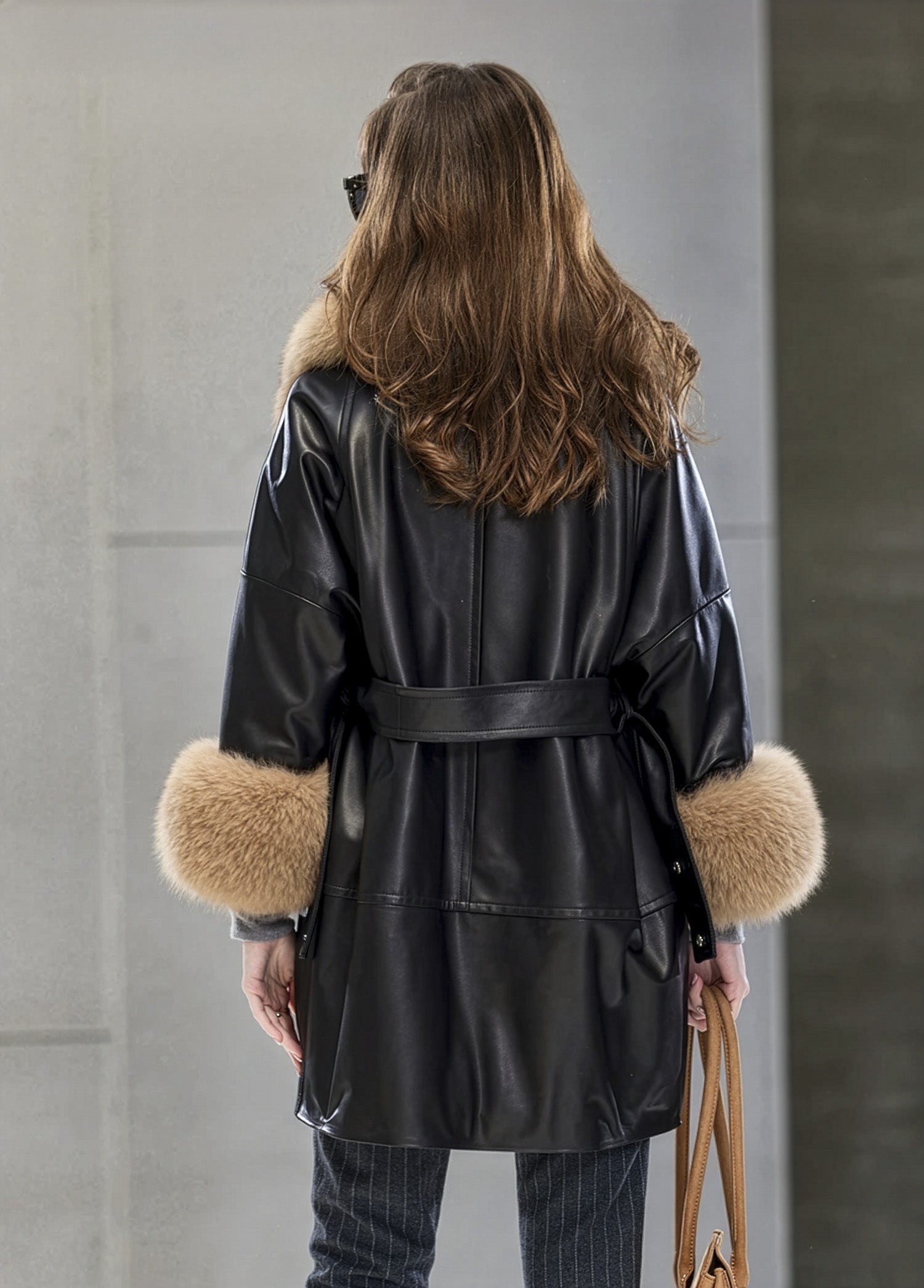 Back view of the Onyx sheepskin coat featuring a clean vertical line and unstructured shoulder drop. — From Borcelleclothes.