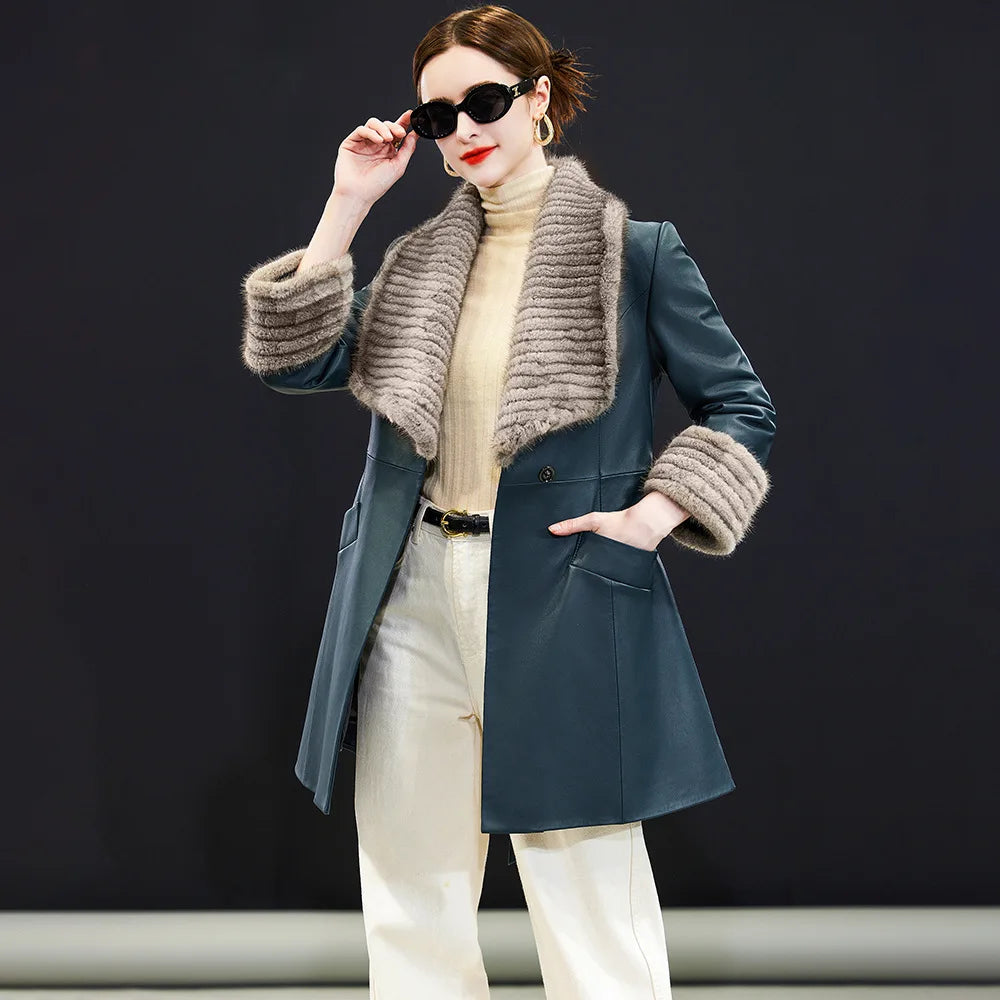 Women's Sheepskin coat in Independence color, with rectangular striped mink collar, extended cuffs, wide welt pockets, and a self-tie belt. — From Borcelleclothes.