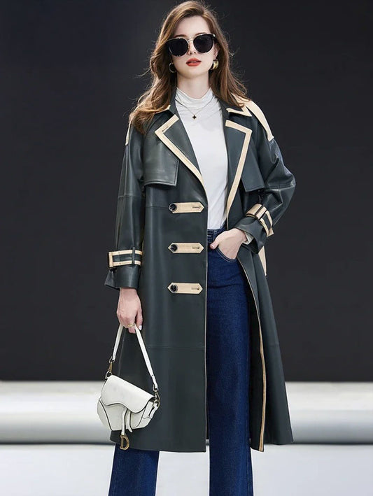 Women's Leather Outer Space Trench. Model rests a hand in the pant pocket, reinforcing the coat’s effortless authority and modern edge. Borcelleclothes.