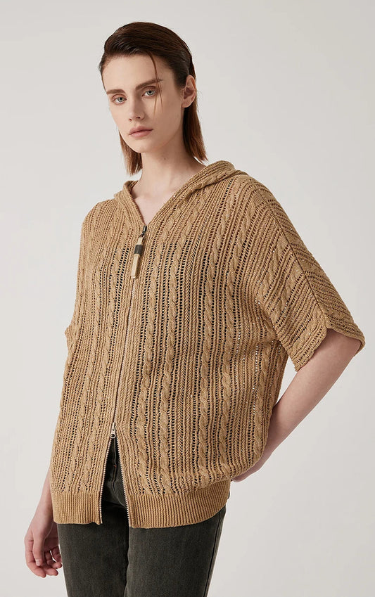 Woman in mocha lace hoodie with one hand behind her back, revealing the airy texture and sleeve details. From Borcelleclothes.