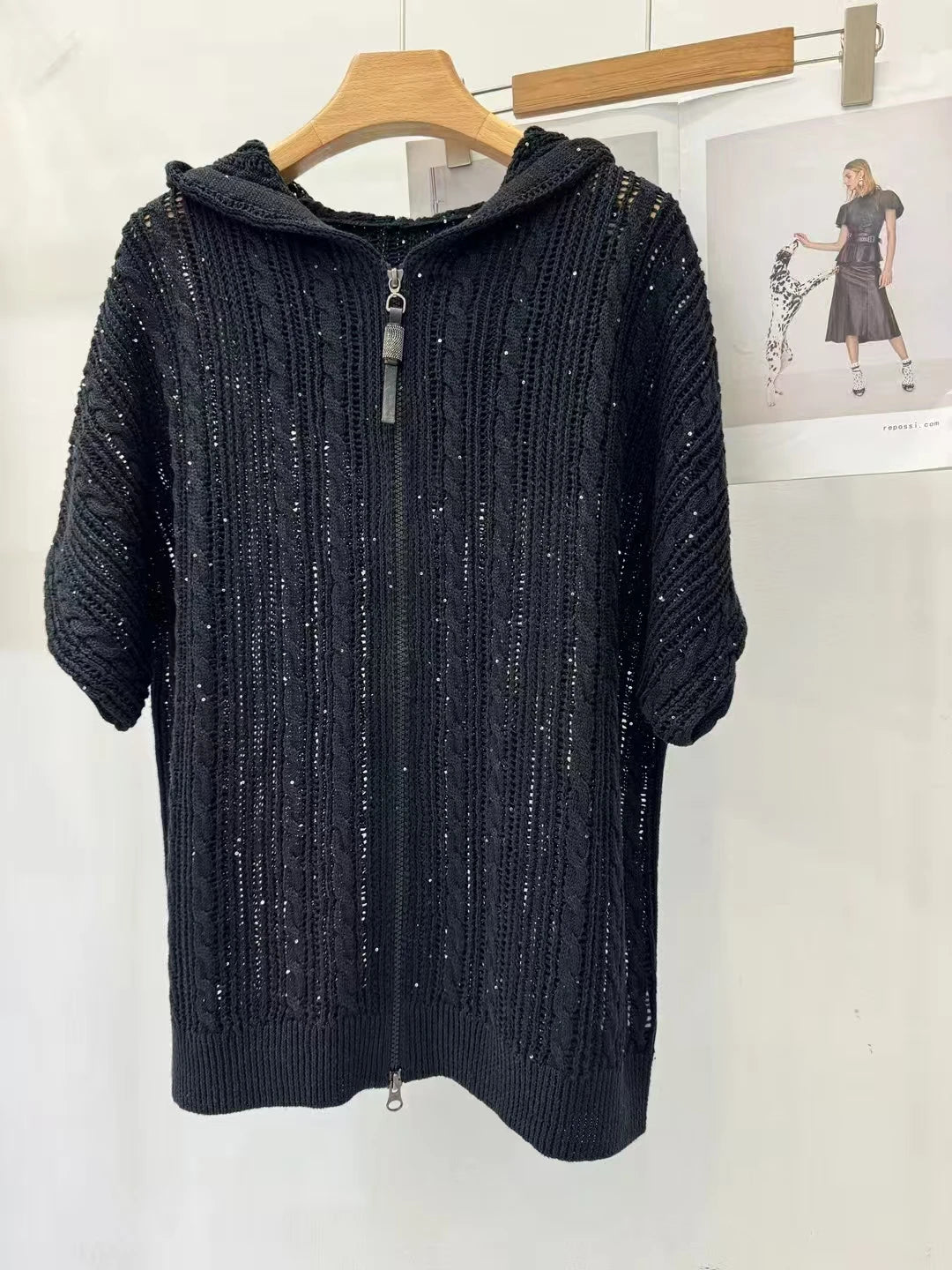 Women's linen lace hoodie in Onyx featuring a translucent knit, braided stitches, a zipper front, and a relaxed hood. From Borcelleclothes.