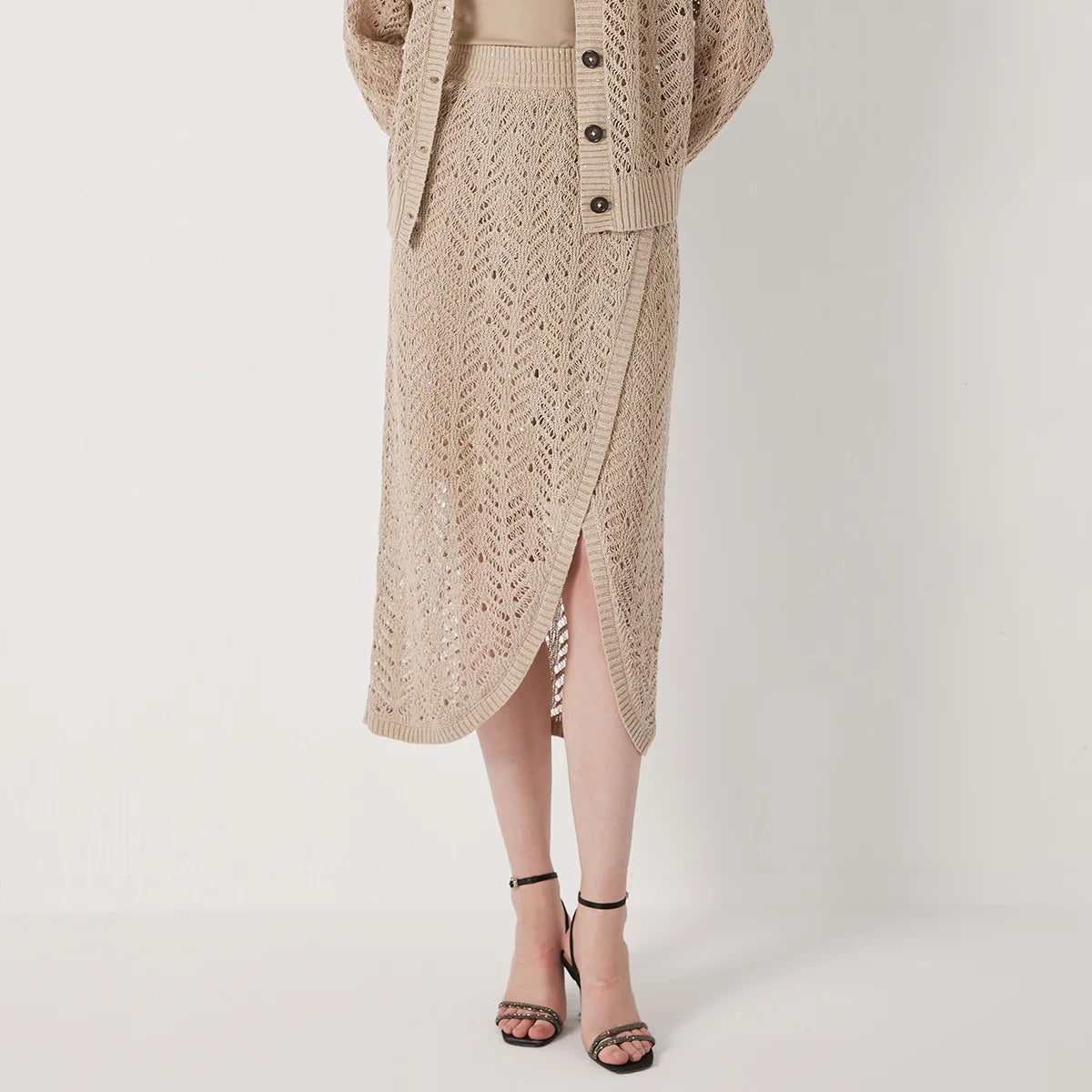 Linen lace skirt in Vanilla with delicate openwork pattern and soft drape, highlighting the airy texture and gentle transparency of the knit. From Borcelleclothes.