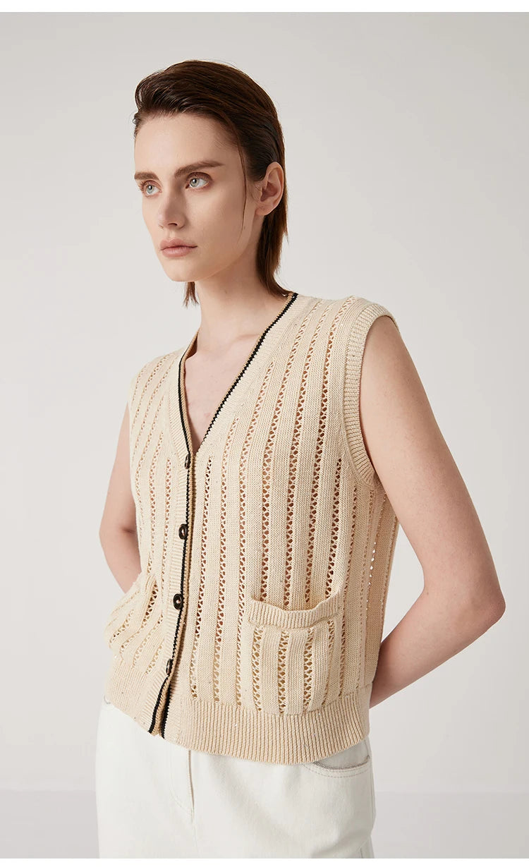 Woman in Almond vest turned slightly to the side, showing refined contrast trim and openwork knit structure. From Borcelleclothes.