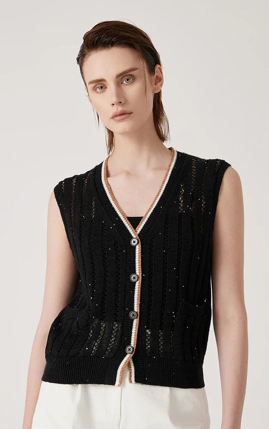 Woman in black linen lace vest standing with arms straight, showing vertical openwork stripes and contrast rib trim. From Borcelleclothes.