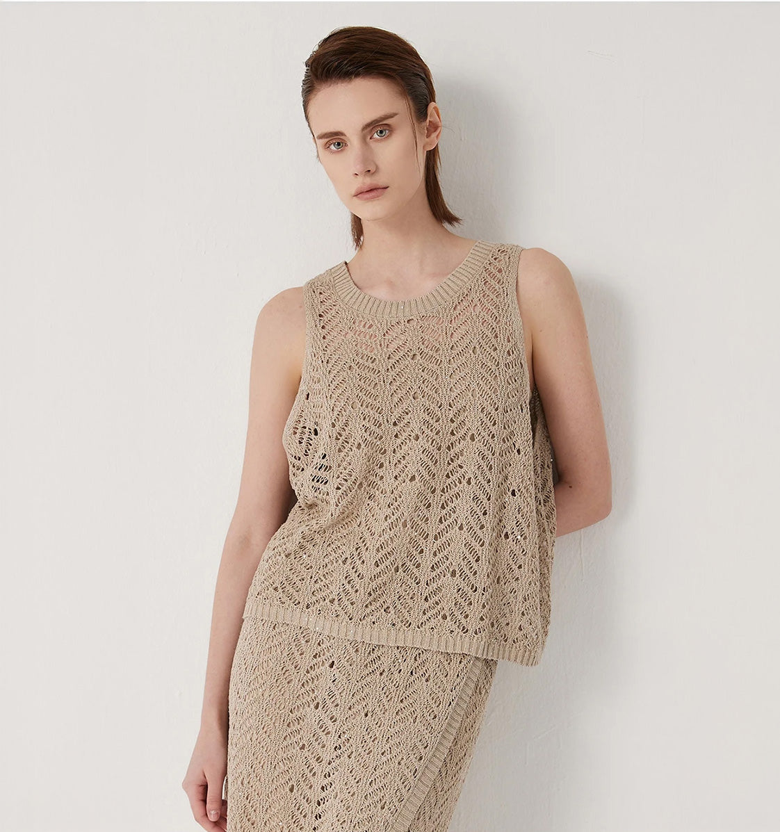 Women's Linen top in Vanilla with wide ribbed neckline and airy openwork pattern, combining festive lightness with sculptural elegance. From Borcelleclothes.