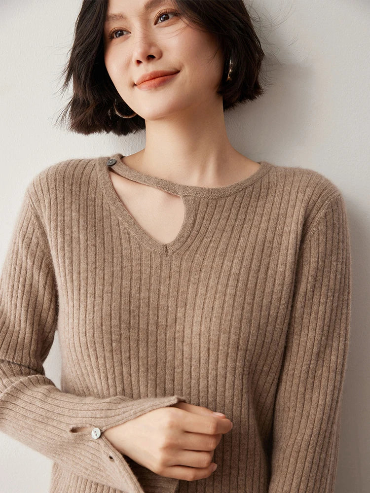 Loop neckline cashmere sweater in Warm Nutmeg with model’s arm softly bent — From Borcelleclothes.