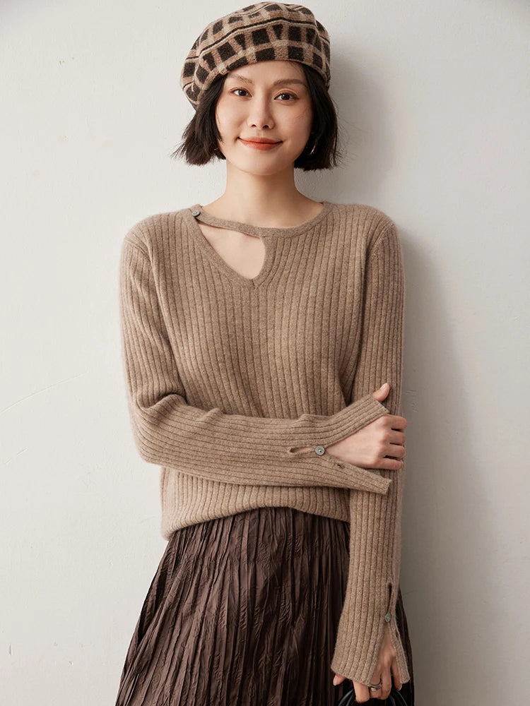 Loop neckline cashmere sweater in Warm Nutmeg with model resting hand on elbow — From Borcelleclothes.