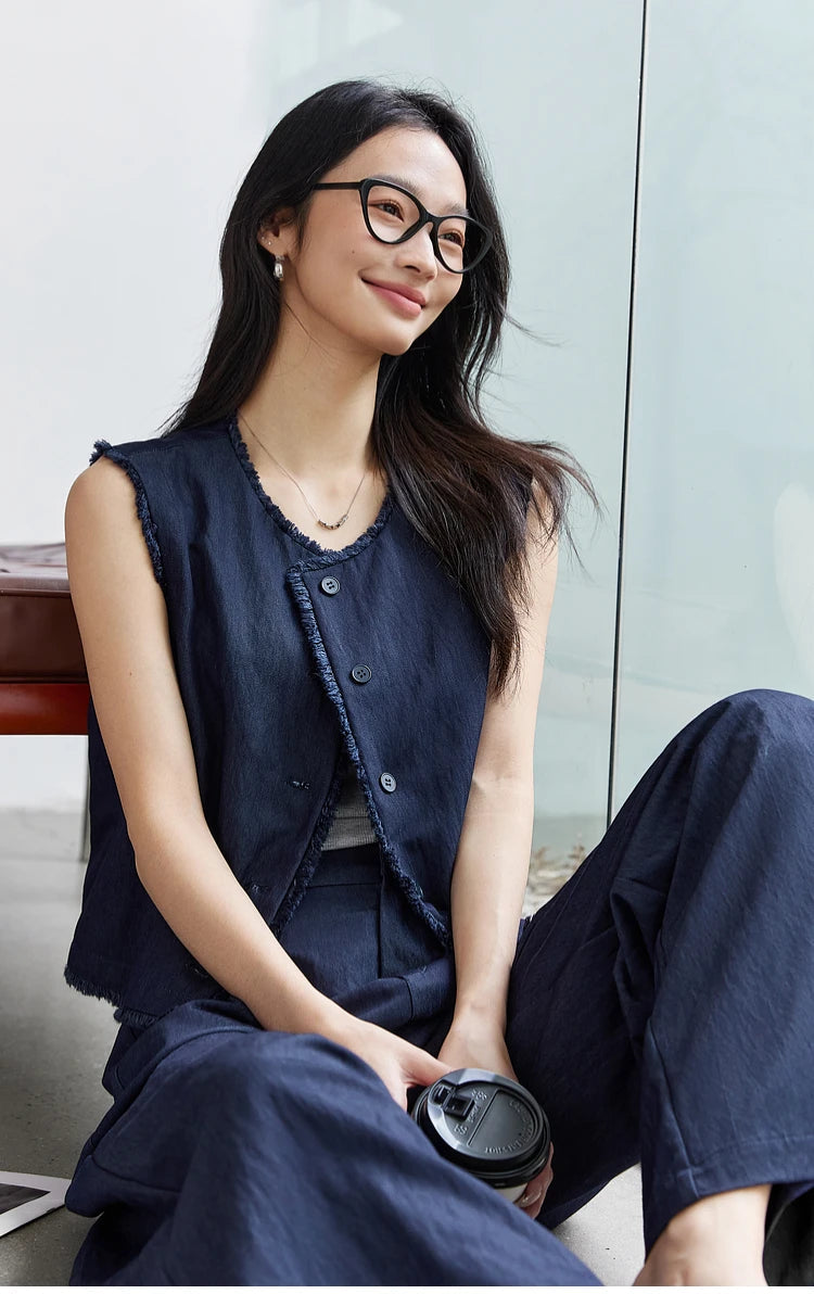 Model smiling while sitting on the floor in the Lucky Point set. From Borcelleclothes.