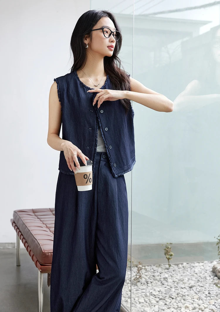 Model standing with a cup of coffee in the Lucky Point set. From Borcelleclothes.