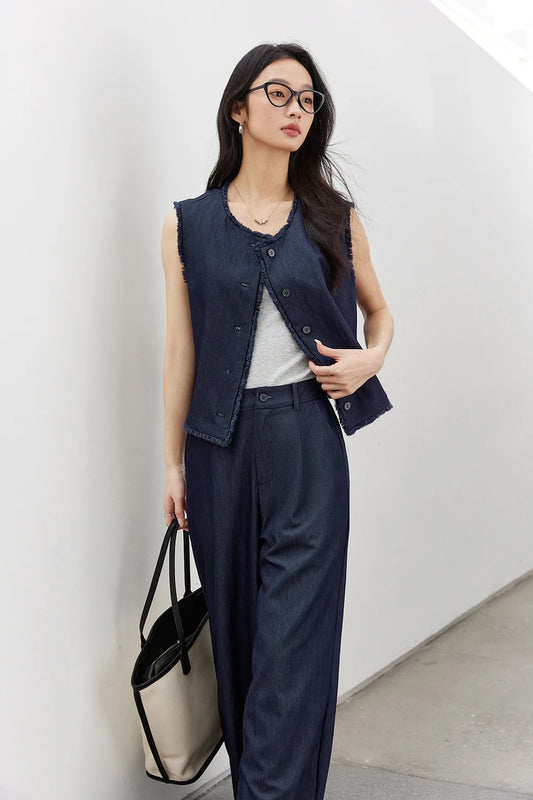 Women’s two-piece set in Lucky Point with sleeveless fringe-trimmed tops and pleated wide-leg trousers in breathable textured fabrics. From Borcelleclothes.