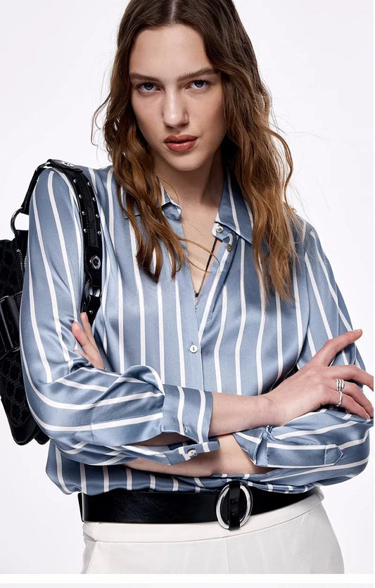 Model with crossed arms wearing Women's Luxury 6A Mulberry Silk Shirt in Beautiful Song, displaying the chic, relaxed silhouette. From Borcelleclothes.
