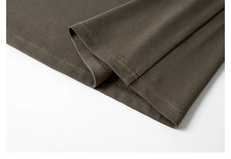 Folded hem of the knit dress, showing the texture and weight of the Makara fabric. From Borcelleclothes.