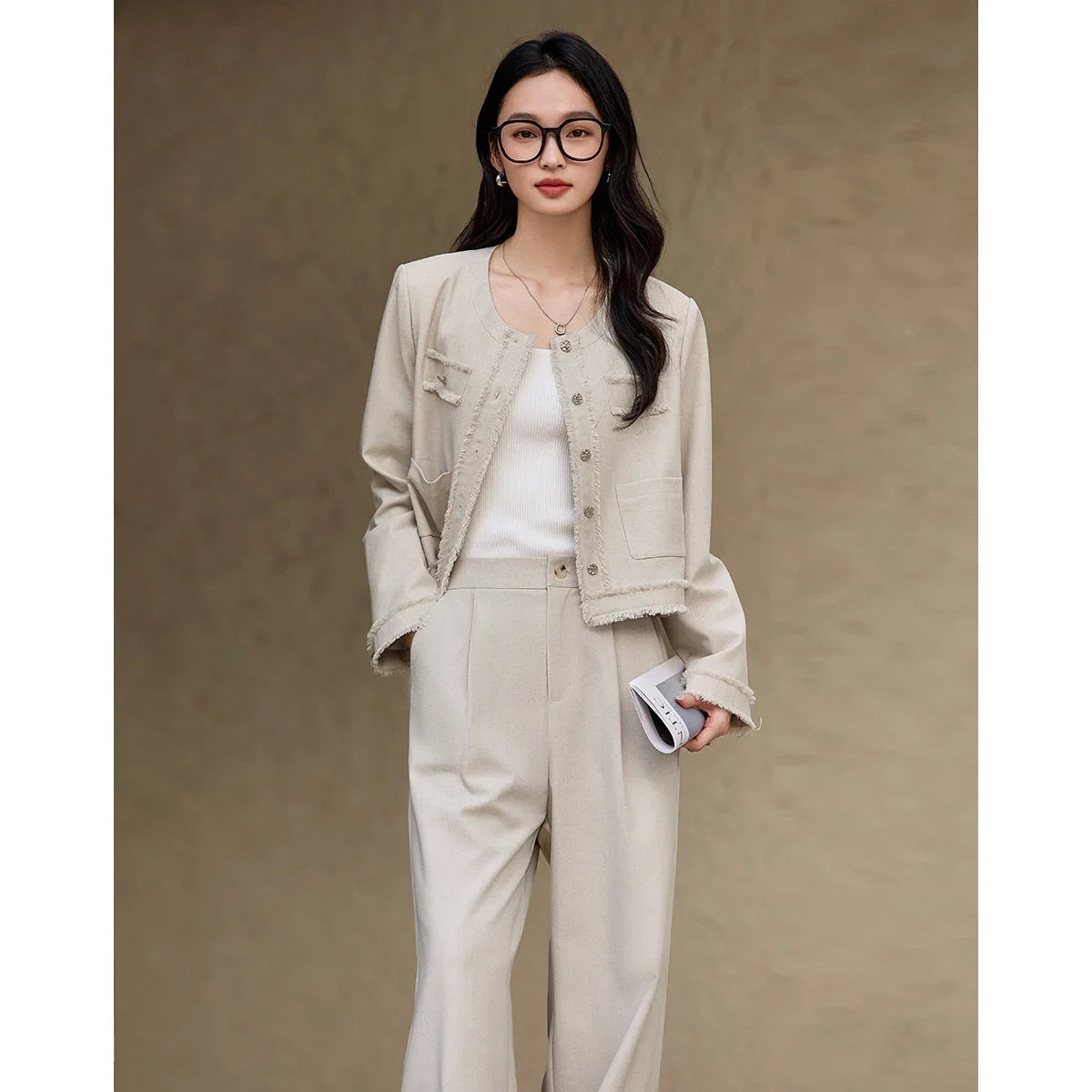 Model wearing the Martini two-piece set with one hand in the trousers pocket, standing with a casual pose. From Borcelleclothes.