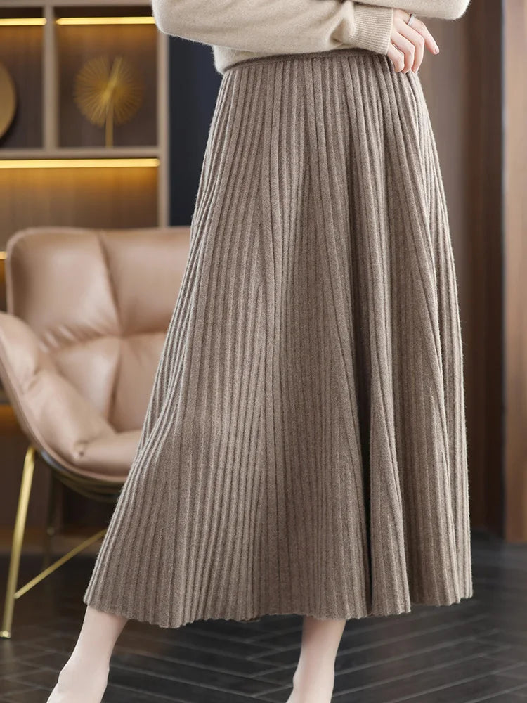 Women's merino skirt in Almond Frost, with textured pleats in soft wool, designed to create the illusion of layered volume and flowing lightness — From Borcelleclothes.