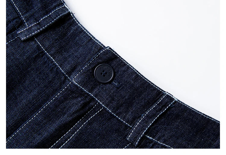 Trousers detail showing single-button closure and belt loops — contrast stitching visible along waistband. From Borcelleclothes.