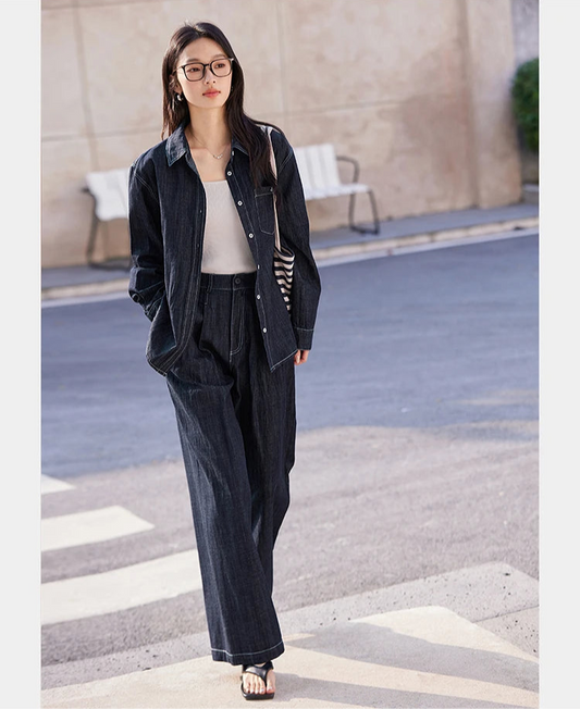 Women’s two-piece set in Midnight Express color featuring a loose-fit shirt with SPROUT embroidery and contrast topstitching, paired with wide-leg tucks trousers. From Borcelleclothes.